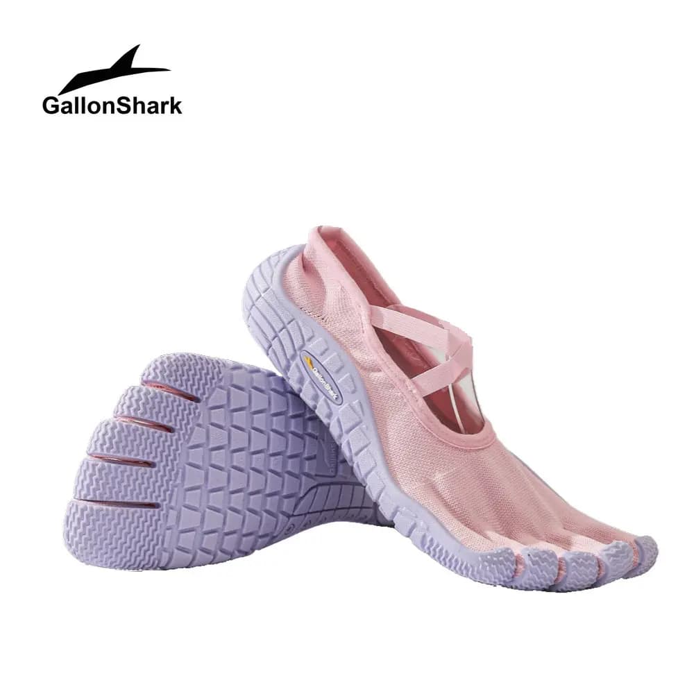 Women shoes with five toes barefoot, separate sneakers with knitting tip with cross strap for yoga, pilates and workouts on the covered floor