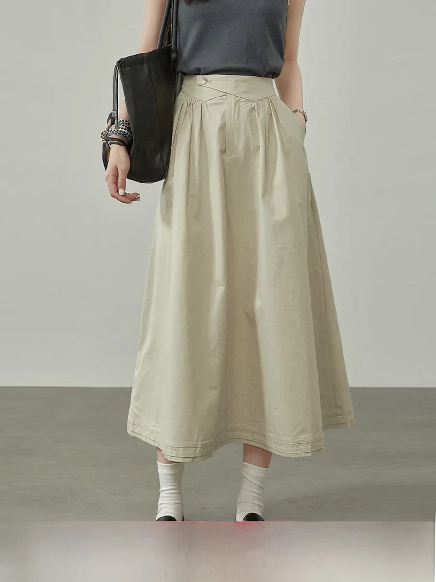 Elegante gonna a vita alta a trapezio da donna, nuova collezione estate 2026, gonna svasata snellente a mezza lunghezza con cintura in vita