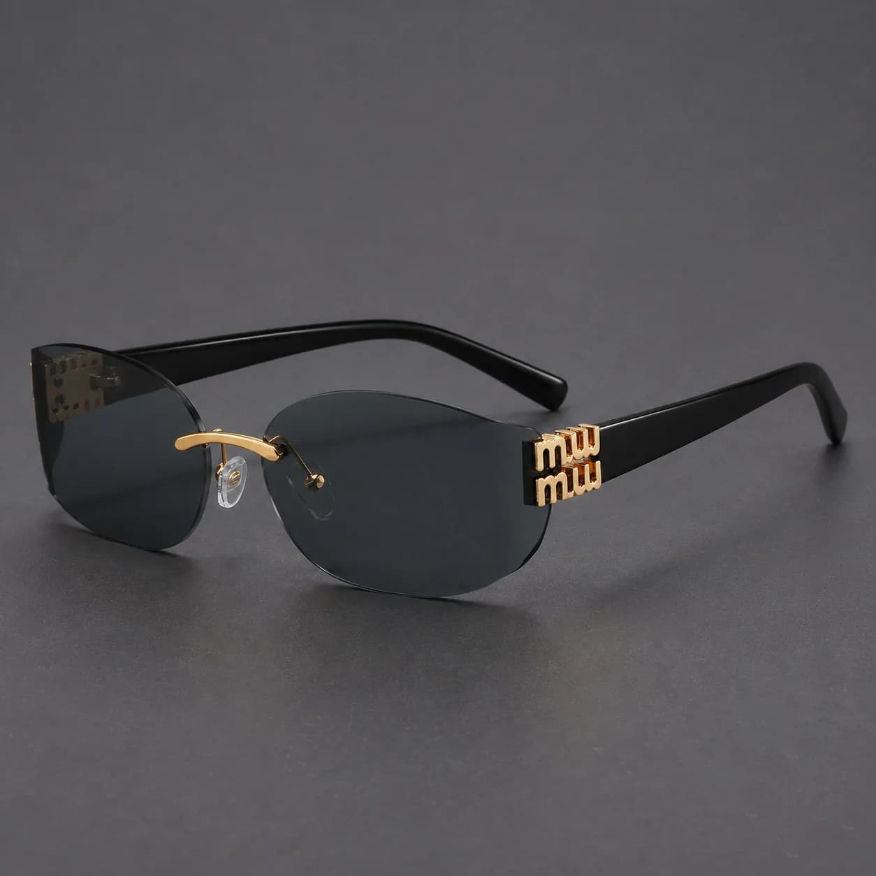 New trendy fashion Spice Girls frameless sunglasses M home design curved cat eye sunglasses Duqiao glasses
