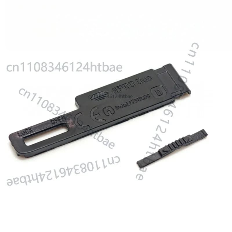 Coperchio del vano batteria con pulsante di blocco e perno di fissaggio per riparazione fotocamera Sony T70