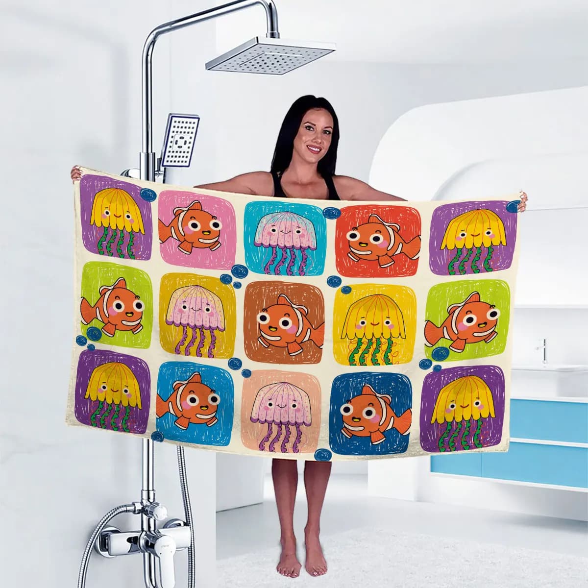 A soft and absorbent travel bathrobe featuring colorful cartoon clown fish and jellyfish prints, made from ultra-fine fibers