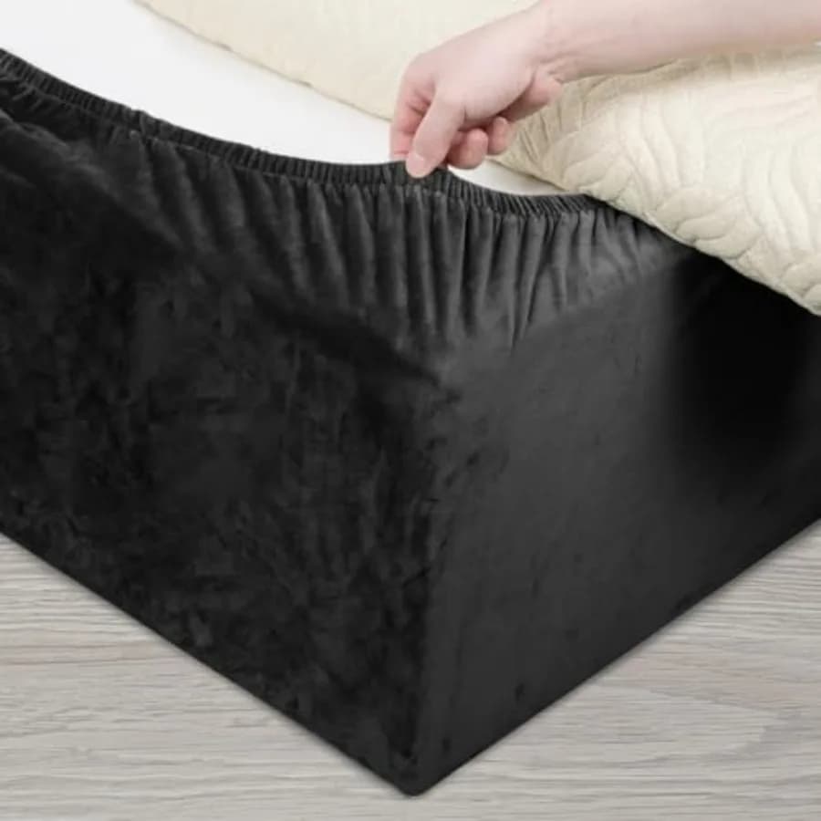 Velvet bed cover, alternative to traditional bed skirt, completely elastic around the base.