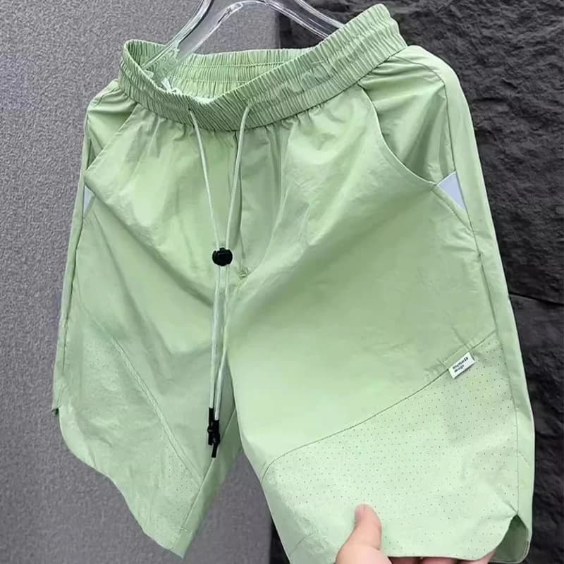 Pantaloncini da lavoro da uomo nuovi estivi Tendenza coreana Solido Casual Tasche larghe Pantaloni al ginocchio Pantaloni neri versatili ad asciugatura rapida