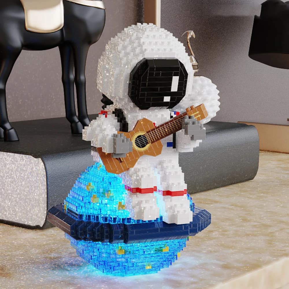 Giocattoli educativi assemblati luminosi modello astronauta per chitarra, adatti come decorazione domestica