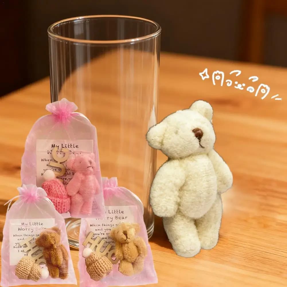 Giocattolo di orso di peluche con abbraccio tascabile con borsa a rete Mini bambola di orso di peluche positiva con cappello lavorato a maglia Regalo di nastro rosa di Natale