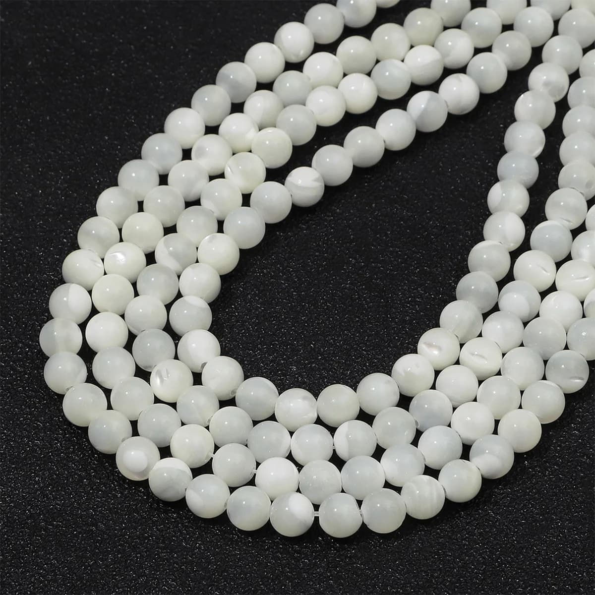 2/3/5/6mmAll'ingrosso conchiglia naturale in rilievo bianco forma rotonda perline sciolte di conchiglia artigianale per la creazione di gioielli braccialetto fai da te collana accesso