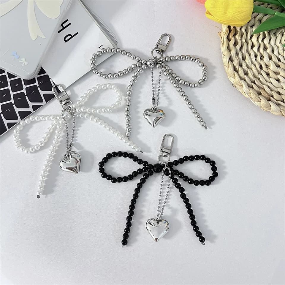 Tendenza bellezza perla arco cinturino amore ciondolo dolce e versatile portachiavi zaino ciondolo per le donne