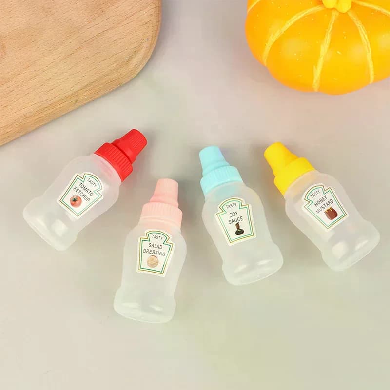4 pz/set Mini Bottiglia di Salsa Ketchup Contenitori per Insalata di Miele Bottiglie Portatile Barattoli di Salsa di Stoccaggio Lunch Box Medicazione Dispenser