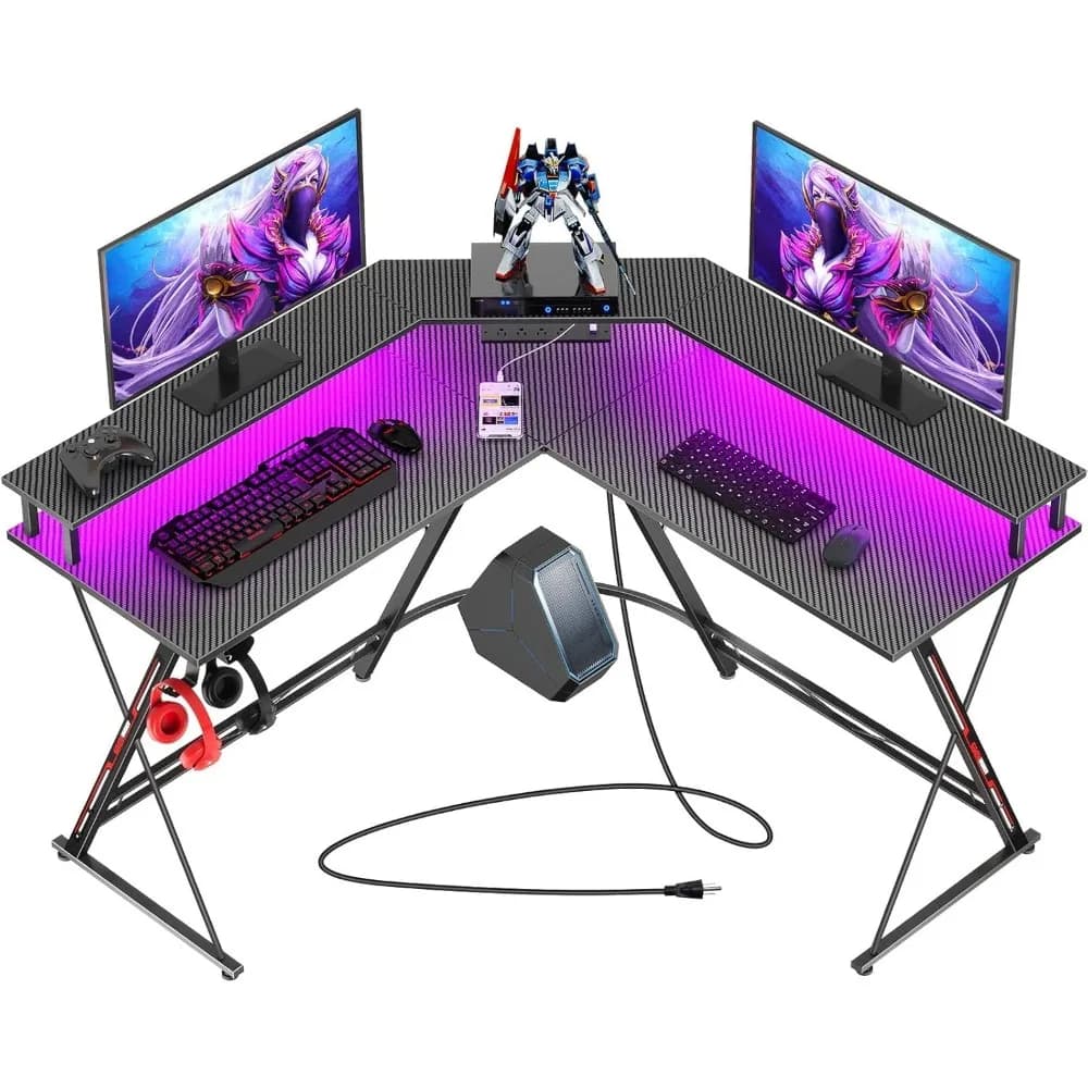 L-shaped gaming desk with LED lights, sockets, monitor support, carbon fiber surface - black