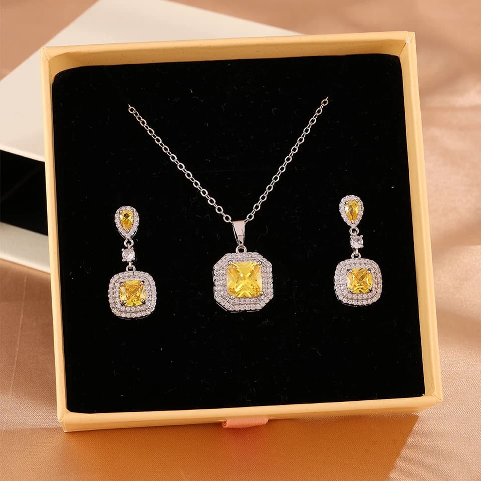 ZAKOL Set di gioielli con orecchini e collana di lusso con zirconi cubici trasparenti/gialli per donna, squisito regalo di gioielli per feste di matrimonio con scatola