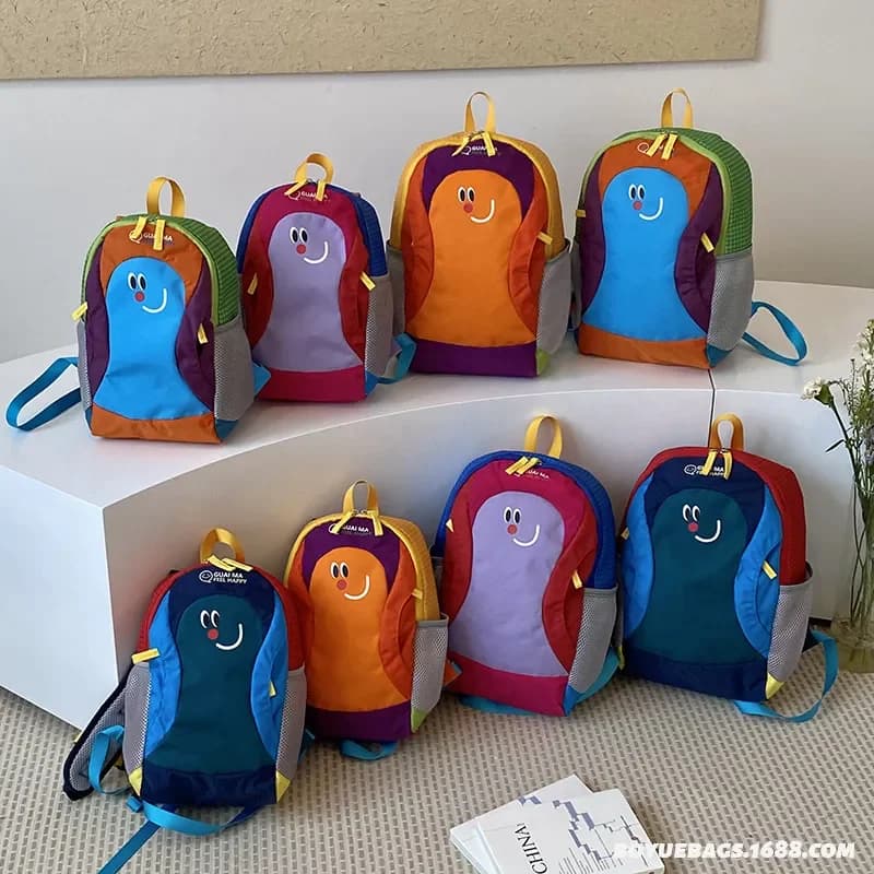 2026 New Dopamine Contrasting Color Cartoon Smiley Face Backpack Lightweight Waterproof Outdoor Research Schoolbag