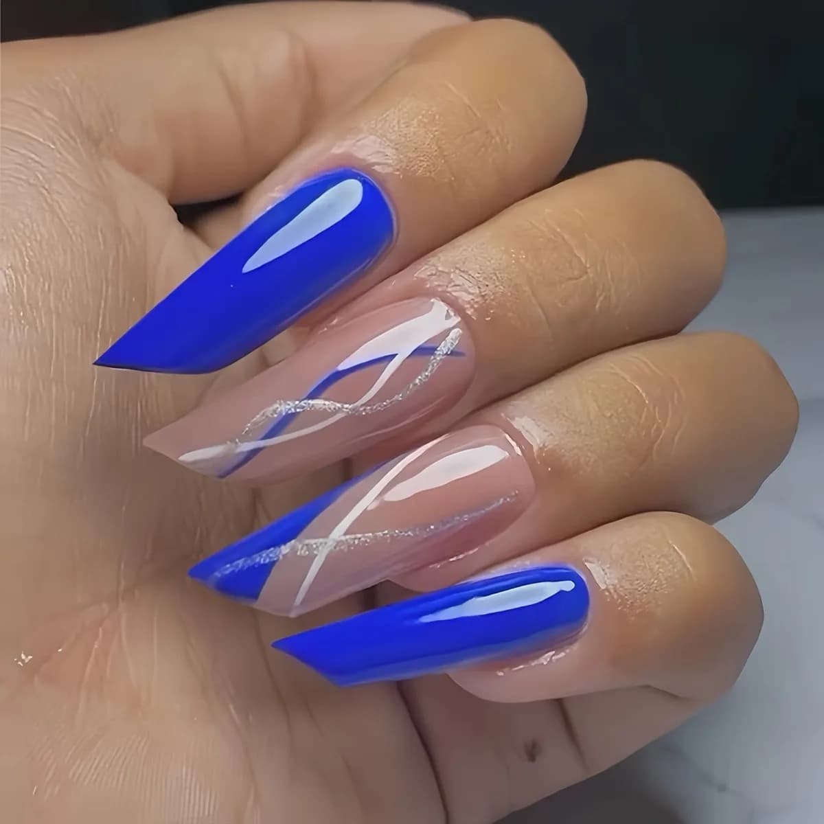 Blue fake nails in French twill shaped lipstick - fashionable nail tips with high-end striped design