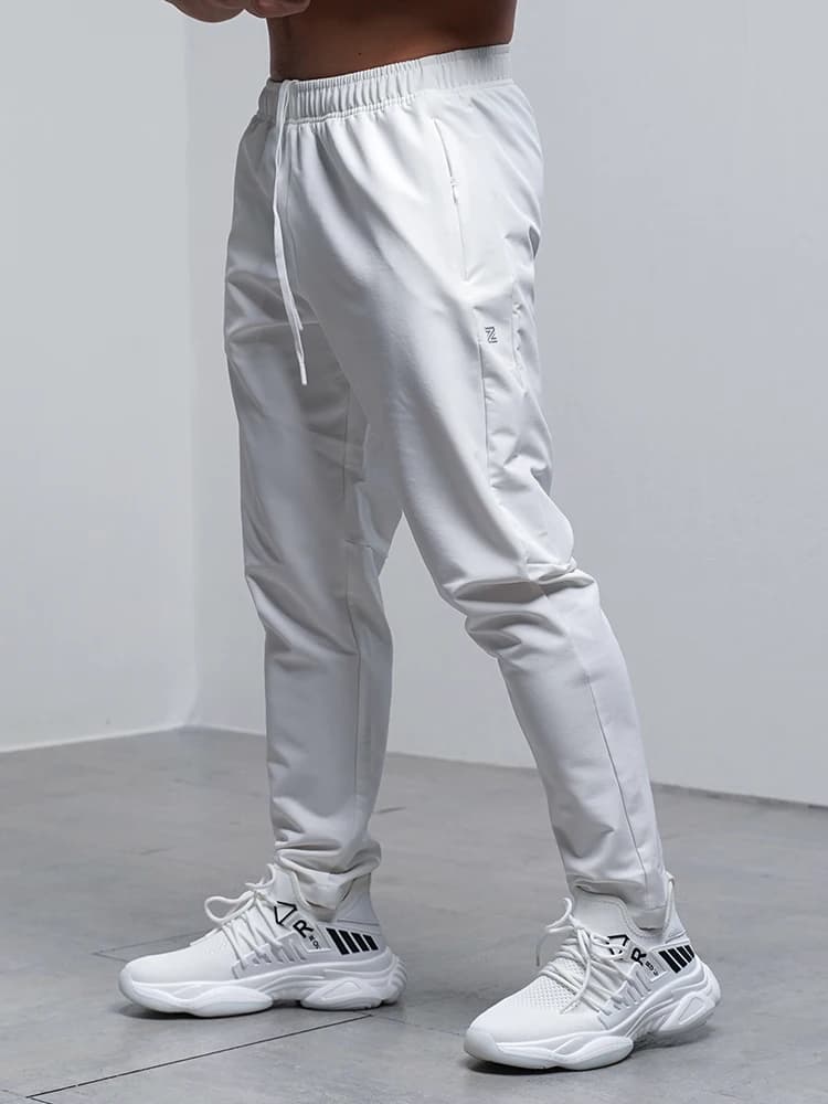 Pantaloni autunno inverno da uomo traspiranti larghi da corsa allenamento sportivo palestra abbigliamento sportivo pantaloni sportivi elastici impermeabili con tasca con zip