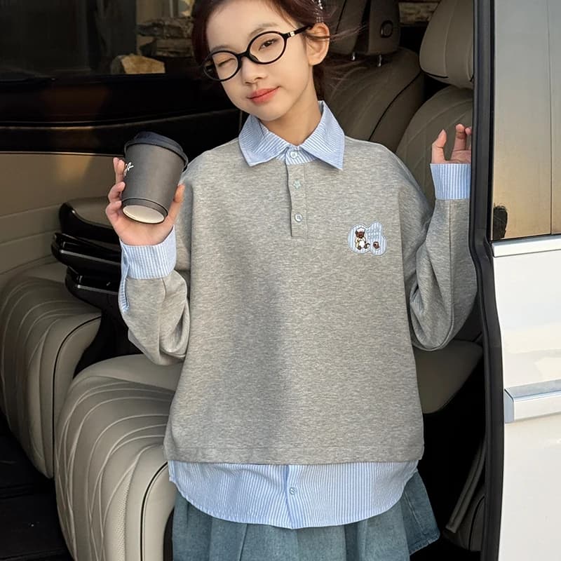 Le felpe con cappuccio da ragazza sono di gran moda in primavera e autunno quest'anno, insieme a camicie e abiti primaverili alla moda per ragazze.