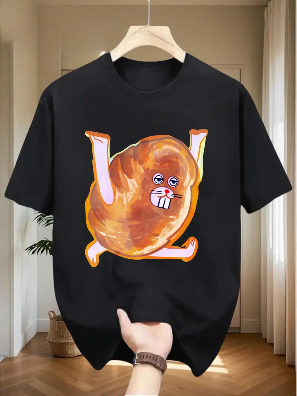 The 2026 "Fun Bread-Bunny" graphic T-shirt is made from 100% pure cotton and features a whimsical character design, highlighting a humorous, cartoon-style take on food.