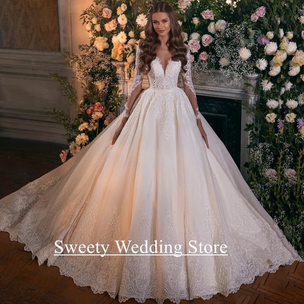 Abito da sposa champagne Abito da sposa personalizzato maniche lunghe scollo a V applicazioni di paillettes A Line Abiti da sposa glitterati per donna