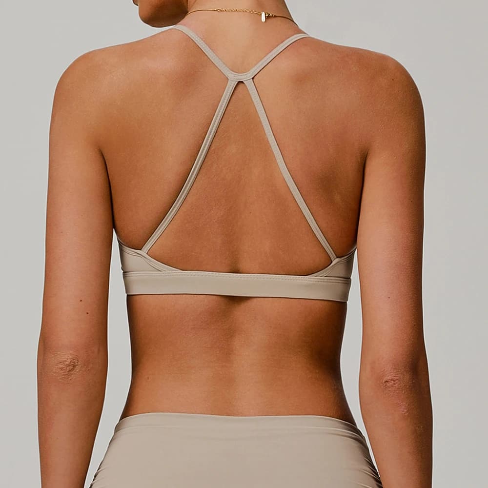Top da palestra da donna Reggiseno sportivo incrociato sul retro Abbigliamento da yoga Allenamento attillato atletico da donna Jog morbido con imbottitura sul petto Intimo sportivo fitness