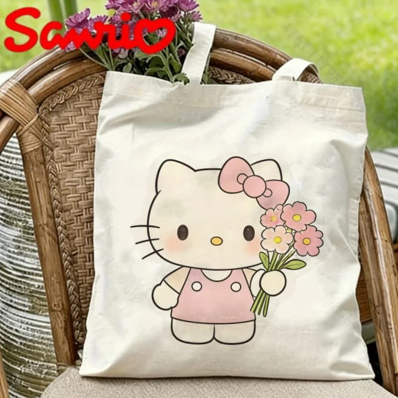1PC Borsa a tracolla in tela leggera con stampa Hello Kitty che tiene un bouquet di fiori rosa per l'uso quotidiano