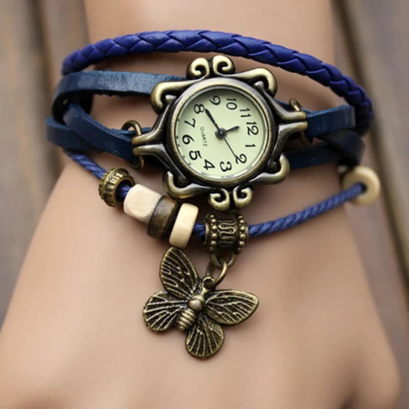 Women's wristwatch with butterfly pendant with fashionable retro leather strap