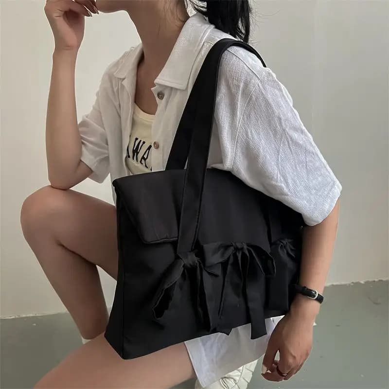 2023 moda nuovo materiale in nylon una spalla borsa da donna piega con fiocco borsa di design studente pendolare borsa per laptop portatile per le donne