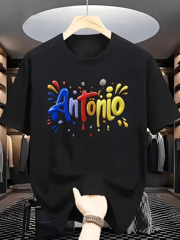 Men's Black Short Sleeve T-shirt with Vibrant 3D "Antonio" Print, Colorful Splatter Art Design, Crew Neck Cotton Tee, Modern Store Display Style
