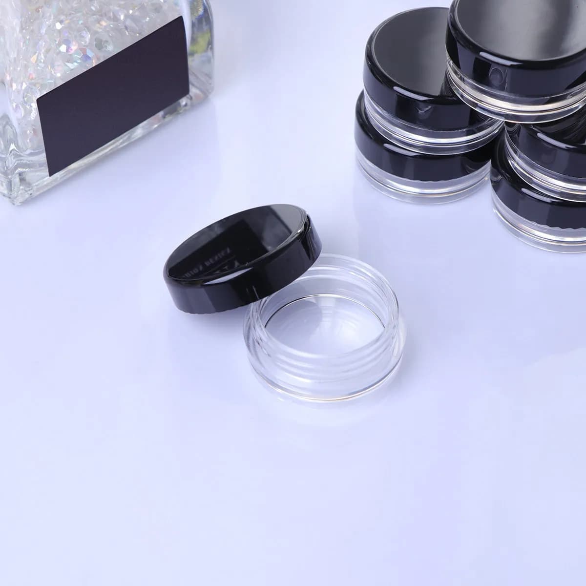 50 rechargeable round black bottles for cream, mini portable containers for face lotion, umbrella, balm, ointment, body butter