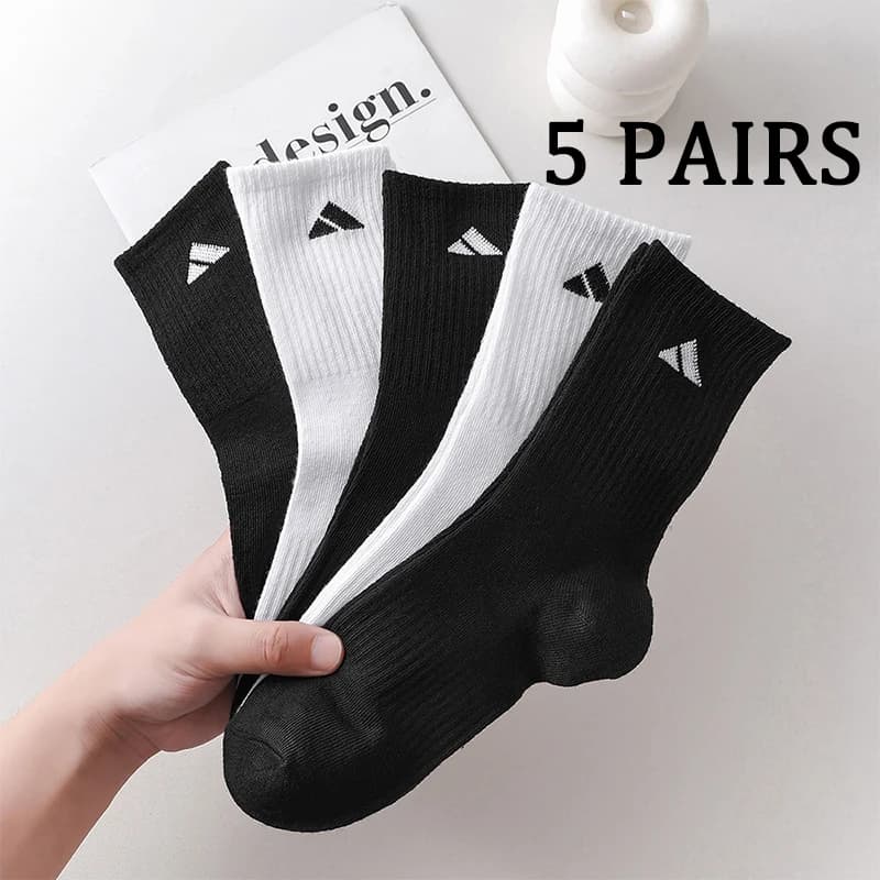 5 pairs of black and white patterned mid length socks suitable for both men and women comfortable and unisex sports socks