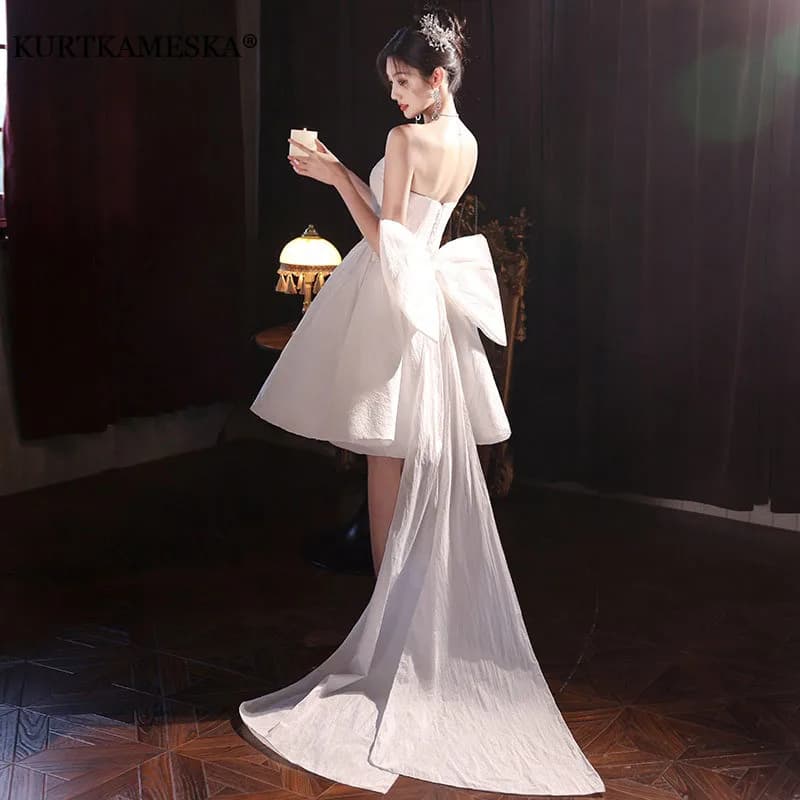 Abiti da sposa Gonna con bretelle con fiocco bianco per donna Abito da sera in raso 2025 Minigonna sexy elegante Abito da cerimonia nuziale semplice