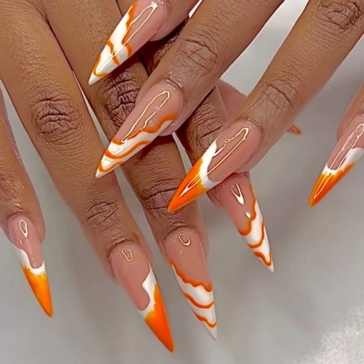 24 pcs. Fin nails Stiletto lengths with Wave design, Full cover, Reusable, Simple oranges in almond, Press-on