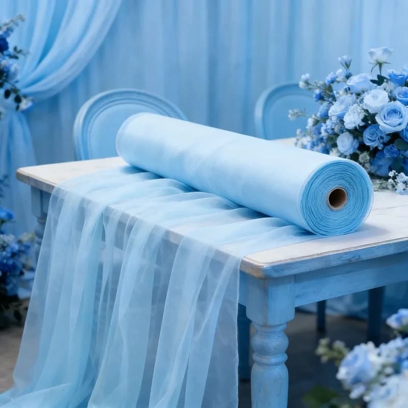 soft mist light blue dreamy tulle curtains for sweet 16 cake table and pastel balloon arch photo booth party decor