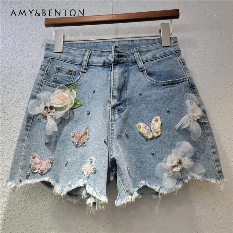 Shorts in denim da donna estivi alla moda, strappati, con ricami floreali e perline, a gamba larga, casual, stile high street