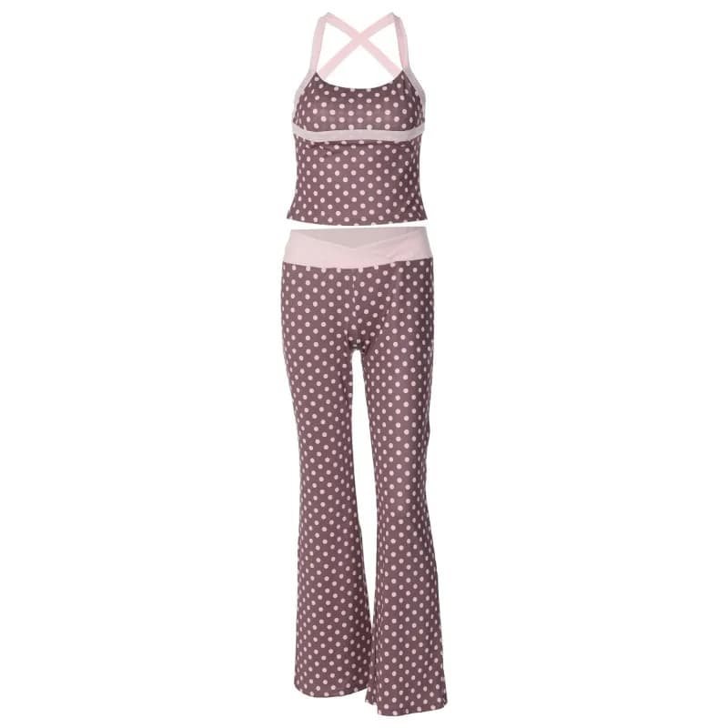 Completo da donna francese estivo 2026: Top a pois stile Spice Girl e pantaloni a vita bassa a contrasto