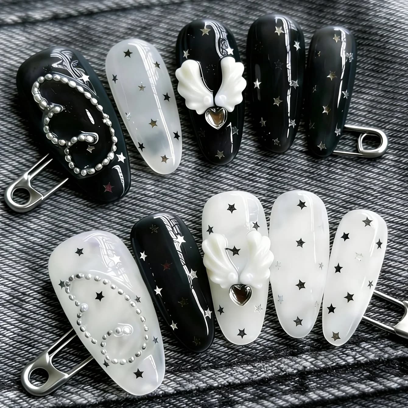 10 pezzi di unghie a forma di mandorla pressate a mano, bellissime unghie finte, note a forma di ala di stella in bianco e nero, adatte per l'uso da parte delle donne