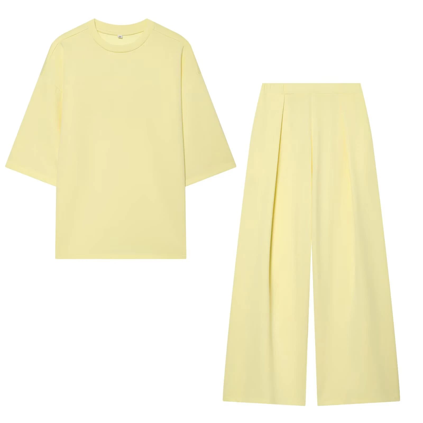 Completo estivo da donna 2026: T-shirt a girocollo a maniche corte con spacco sull'orlo e pantaloni a gamba larga a vita media elasticizzata