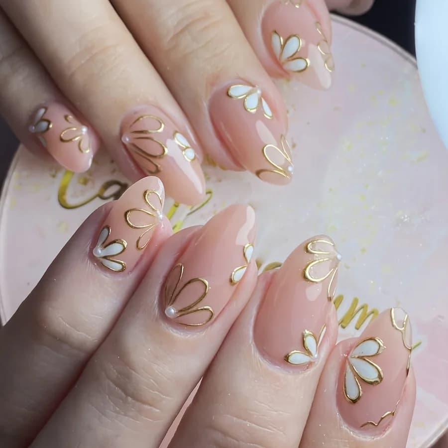 24-piece almond-shaped press-on nails - Nude and gold floral design with accent dots, glossy surface, medium length, elegant butterfly pattern, suitable for women's daily wear or special occasions, occasion nail art | ornaments, nail art floral charm
