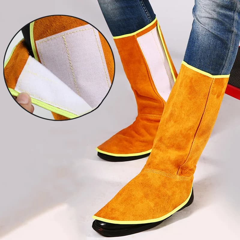 Saldatura Sicurezza sul lavoro Protezione per le gambe del piede Pelle bovina Ignifuga Isolamento termico Resistente all'usura con fascia elastica VELCRO