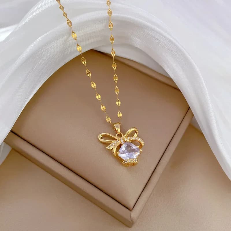 Collana con ciondolo d'amore con chiusura a fiocco in zircone trasparente lucido in acciaio inossidabile per regali di gioielli per feste di compleanno con catena a clavicola per ragazze da donna