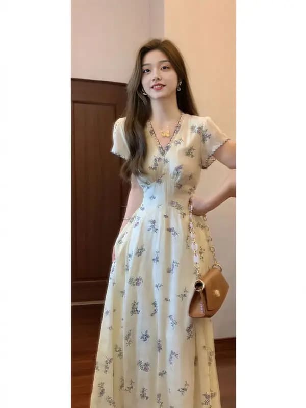 Beautiful long dress with floral print and V neckline. Beautiful summer skirt in delicate style, cotton material, short sleeve, fashionable woman's dress.