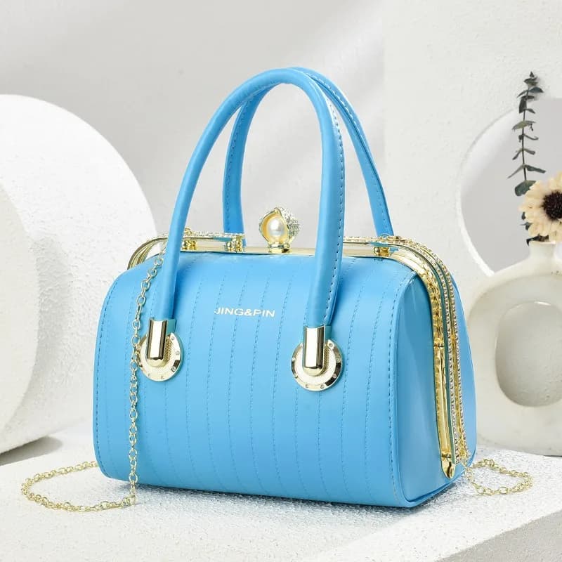 Borsa a tracolla a tracolla con catena a trama di fascia alta versatile alla moda per le donne Borsa a cuscino Boston di nuovo arrivo estivo