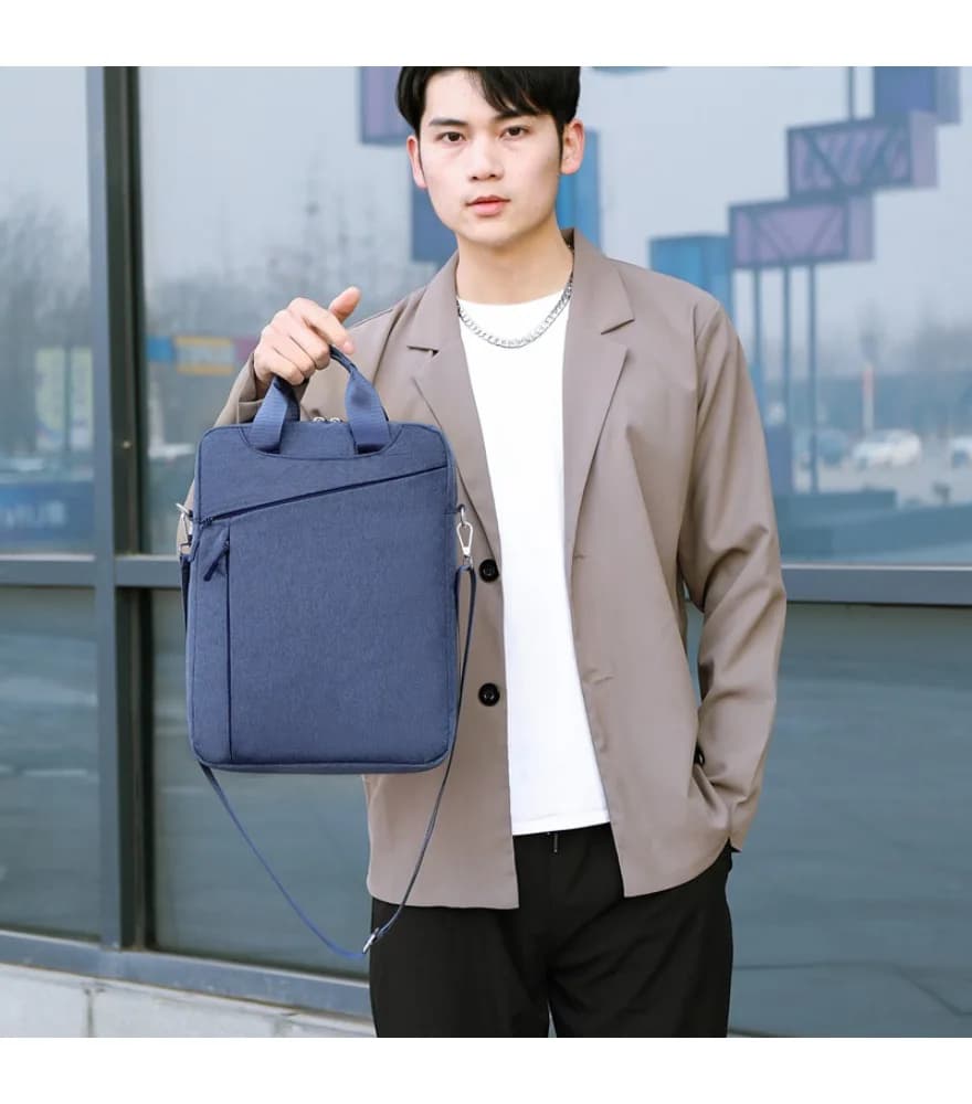 Light gray vertical laptop sleeve bag diagonal front zipper detachable adjustable shoulder strap dual top hand grip lightweight