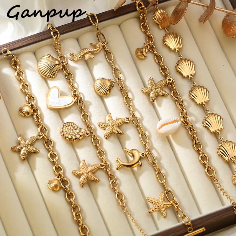 GANPUP Bracciale rigido con ciondoli in conchiglie di stelle marine color oro in acciaio inossidabile 316L per gioielli impermeabili stile oceano di lusso da donna