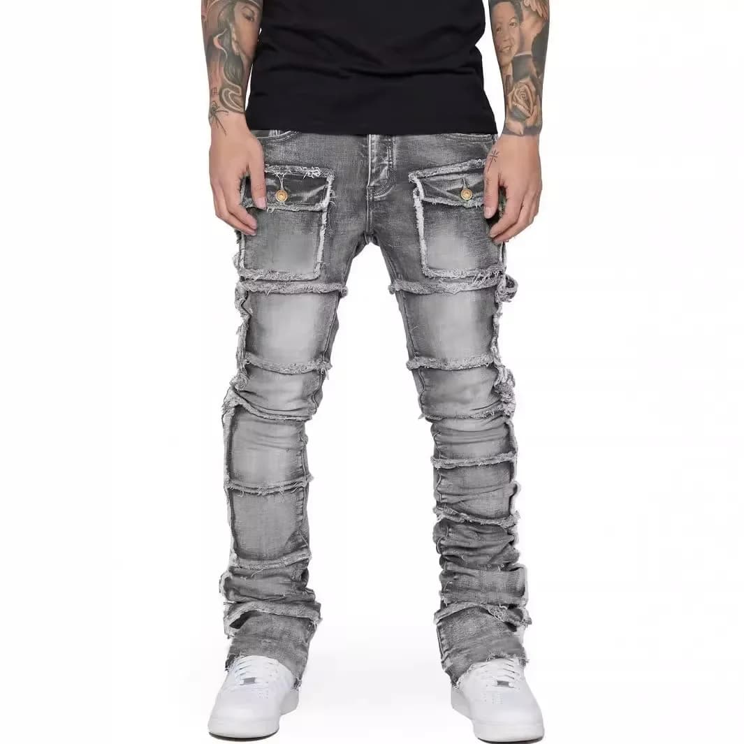 Jeans da uomo alla moda, abbigliamento da lavoro alla moda europeo e americano con toppa, pantaloni in denim da uomo elastici, laminati e leggermente svasati.