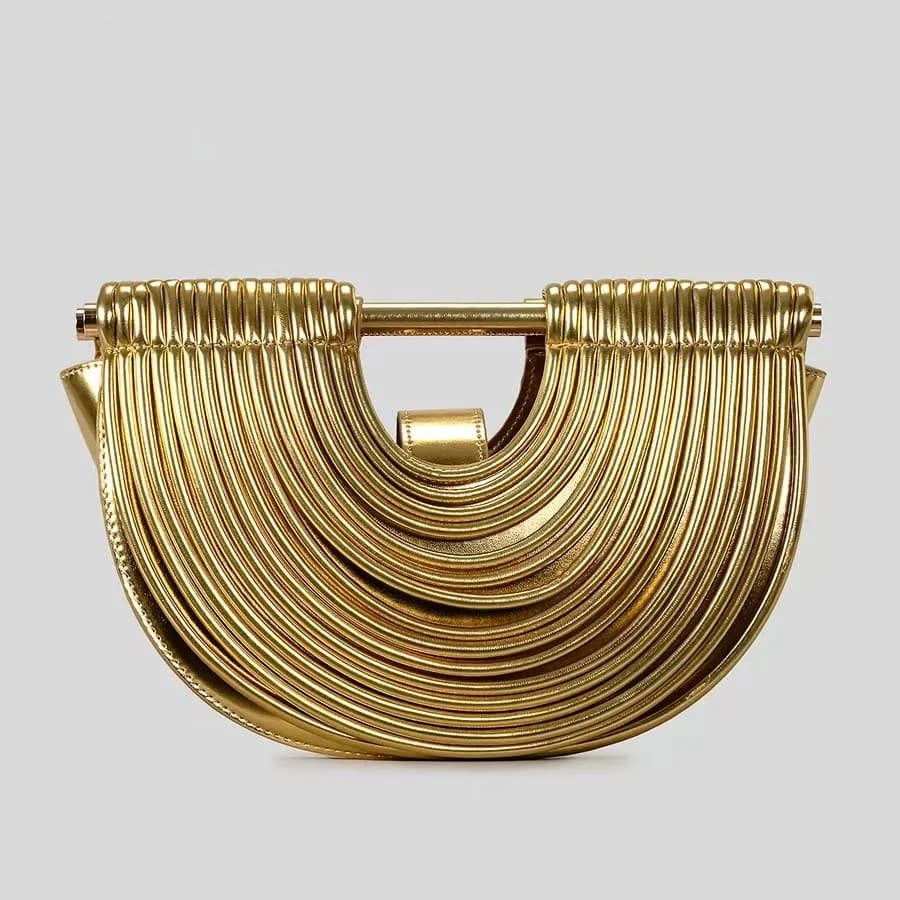 Borse da donna 2025 Nuovo marchio di design di lusso in oro Borse da noodle intrecciate a mano Mezza rotonda tirata Hobo Pochette da sera in argento Chic