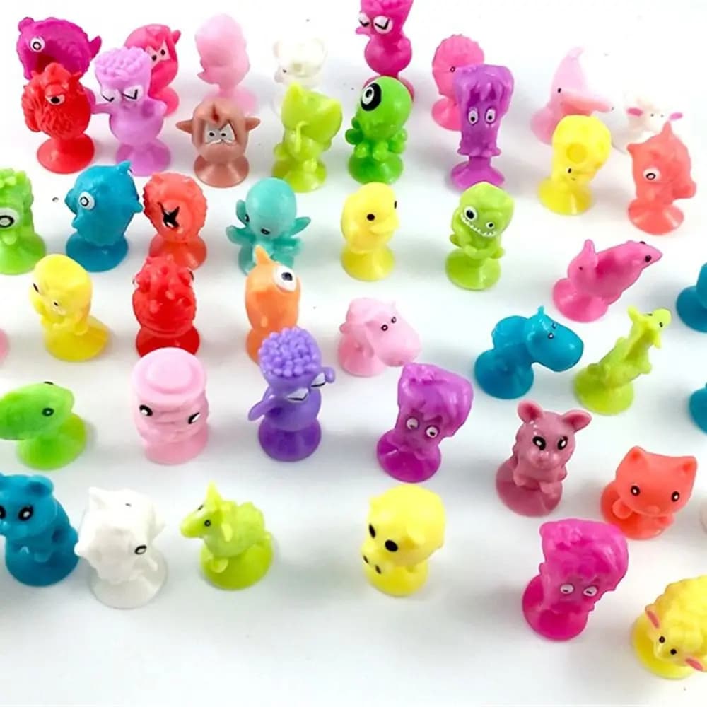 Regali: Mini personaggi d'azione in silicone a forma di animali dei cartoni animati, modelli a ventosa per capsule, pupazzi a ventosa