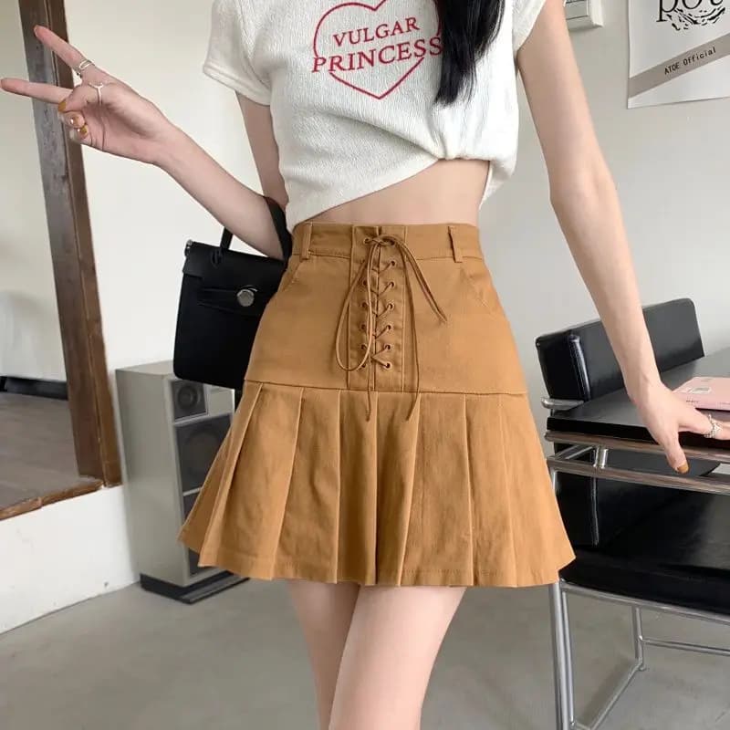 Gonne a pieghe con fasciatura tinta unita moda Abbigliamento femminile 2025 Estate Nuove minigonne a vita alta con cerniera stile preppy allentato