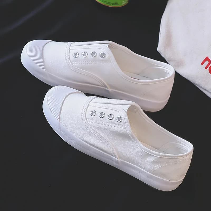 Nuove scarpe di tela bianche da donna Sneakers casual piatte traspiranti slip-on basse per il comfort di camminata quotidiana del campus scolastico