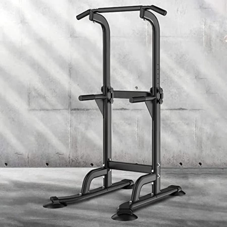 Home gym power tower with steel frame, black finish, adjustable dip bars and pull-up bar for versatile strength training