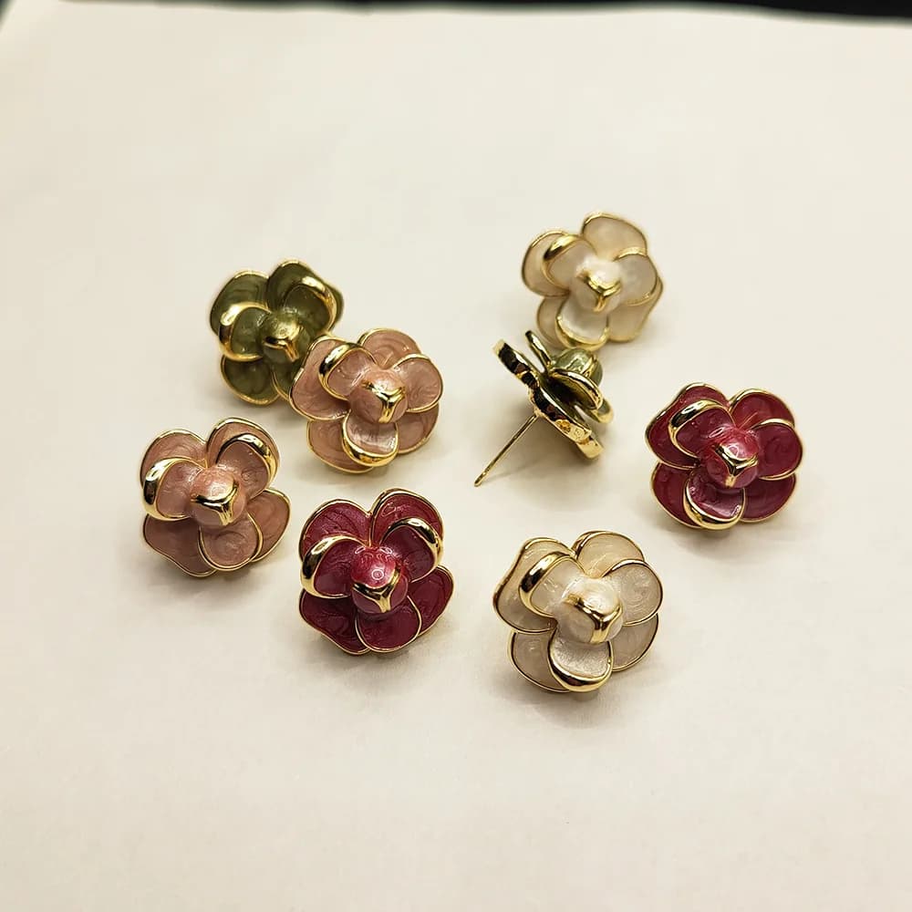 Vintage-chic, Hong Kong–style earrings: a three-tier camellia design, trendy enamel‑glazed drop studs.