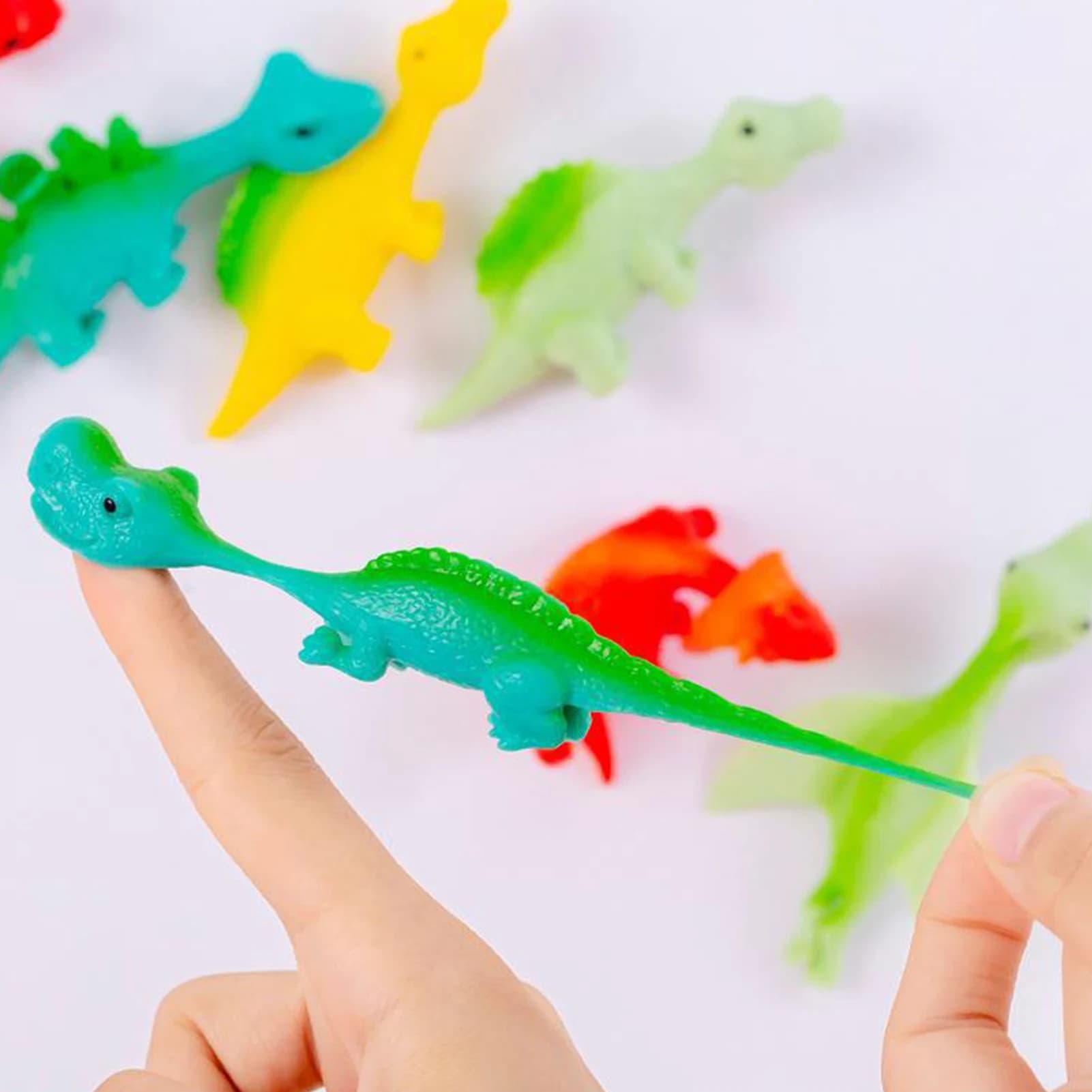 Dito Catapulta Dinosauro Giocattolo Divertente Mini Gomma Dino Finger Sling Shot Giocattoli per Natale Compleanno Goodie Bag Stuffers