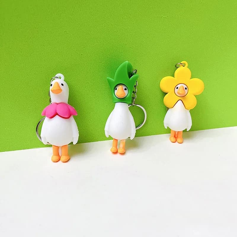 Portachiavi a forma di anatra con fiore, simpatico anello portachiavi per donna, uomo, amico, regalo creativo, divertente, cartone animato, bambola a forma di oca, ciondolo per borsa o chiavi dell'auto